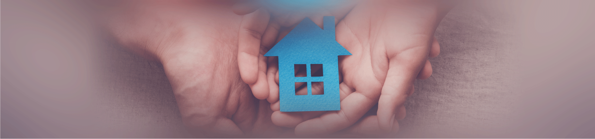 hands holding cutout of house