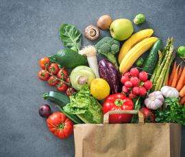 Grocery bag overflowing with healthy vegetables 