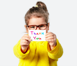 young girl holding a thank you card