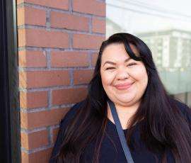 Kelly Contreras-Gomez in front of her new home.