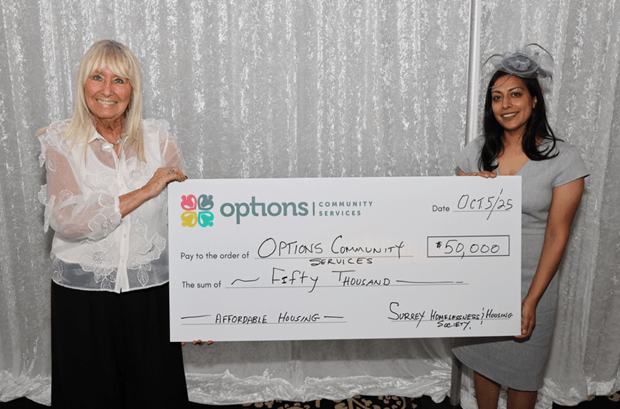 Ginny Hasselfield (left), Director of Development of Options Community Services, receiving the cheque from Pardeep Kooner, Surrey City Councilor and Surrey Homelessness Housing Society