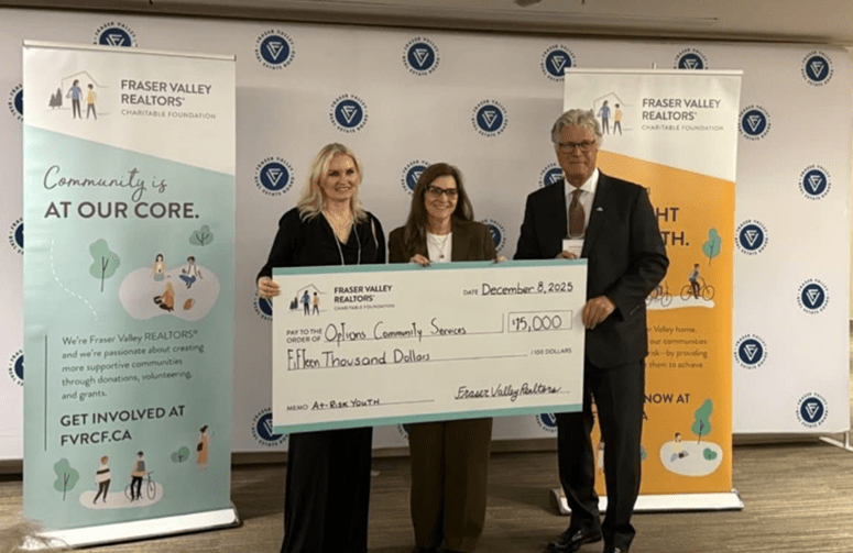 Tammy Dyer (middle), Executive Director of Options Community Services, receiving the cheque from Fraser Valley Realtors Charitable Foundation