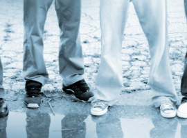 Young people standing in puddle