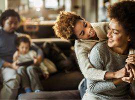 African American Mom and Daughter Hugging