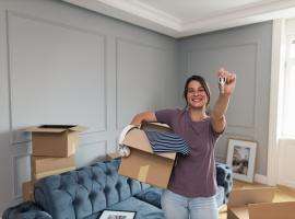 Young Woman Moving In with Keys