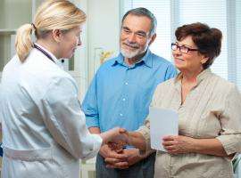 Doctor talking to a Senior Couple